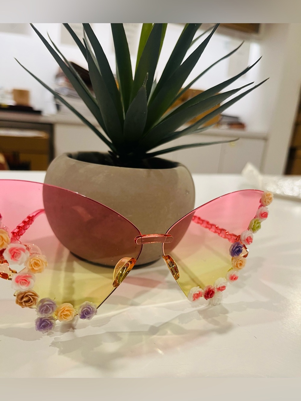 NWT Butterfly wing sunglasses (resin) feature a vibrant pink-to-yellow gradient